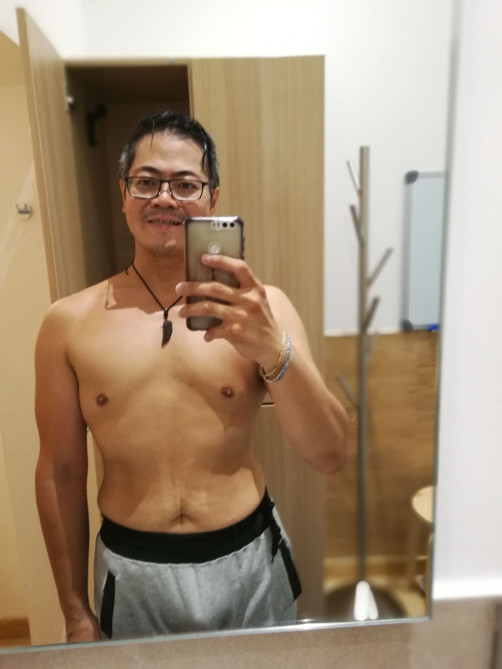 Me at the lean end of the swing, same mirror, a year of patience later.